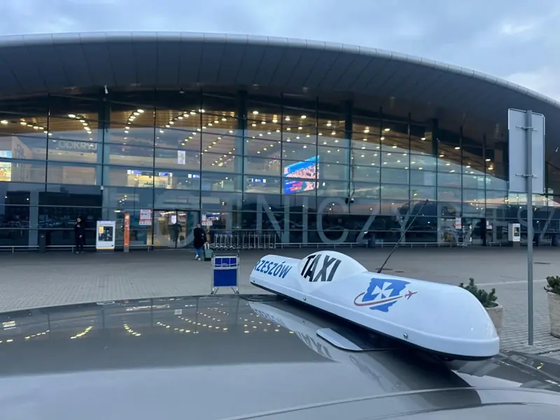Taxi Rzeszów sign in front of the Jasionka airport terminal